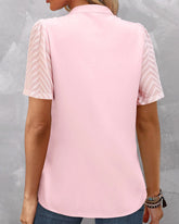 V-ringad enfärgad kortärmad blus